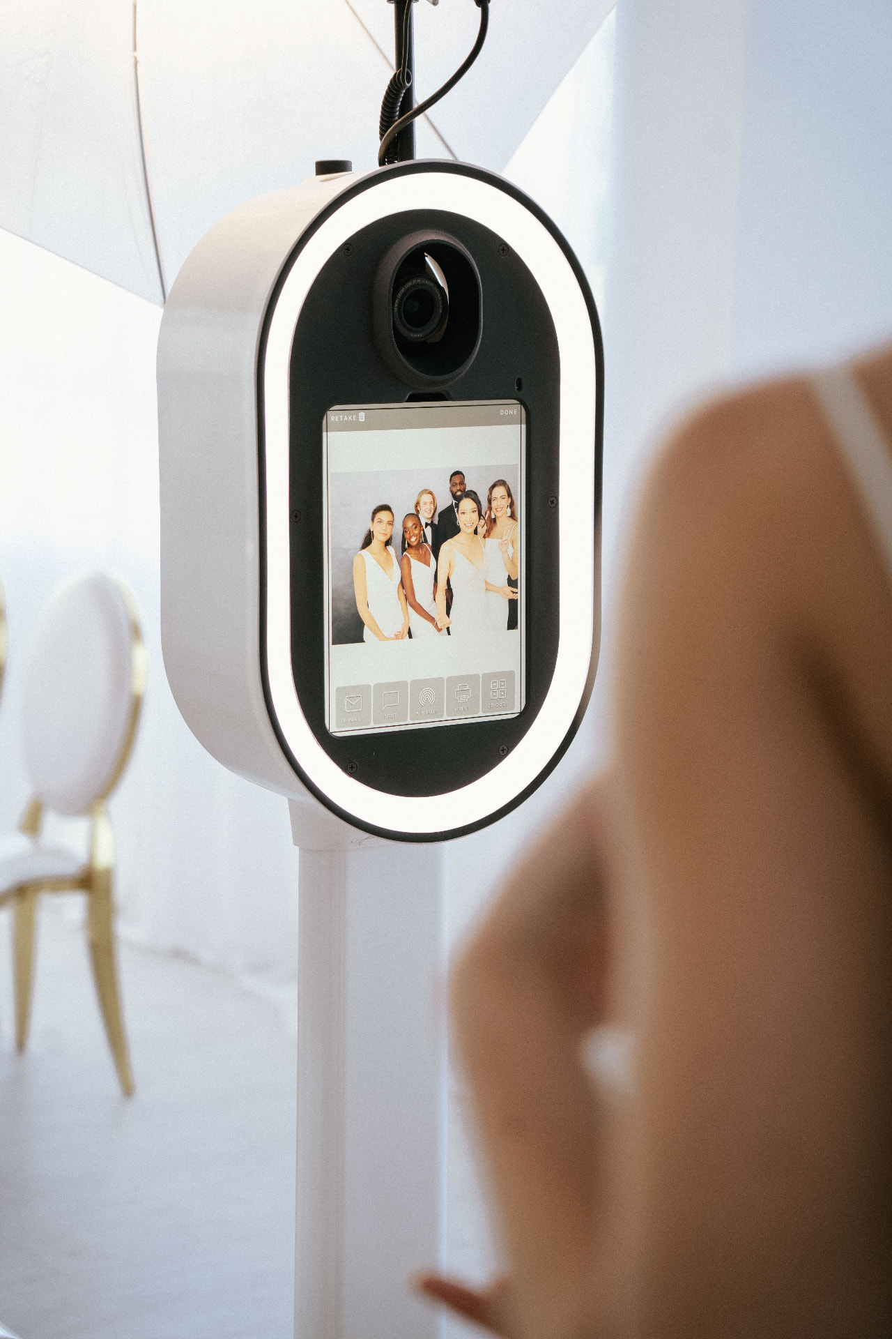 Close-up of the photo booth screen showing a wedding party photo